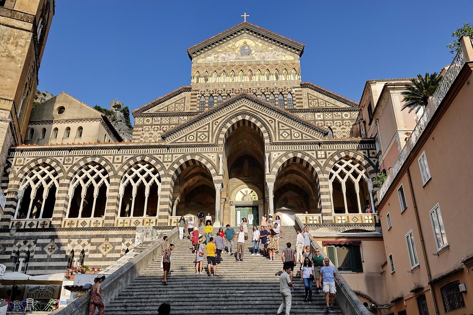 The striped facade and great stairway of Amalfi Cathedral, a highlight of the Amalfi Coast from Naples