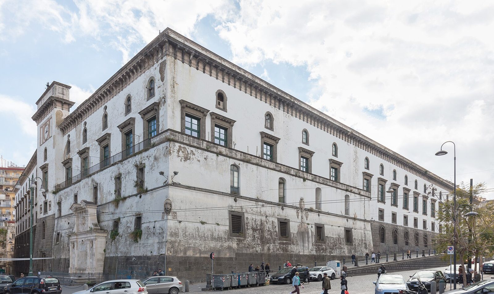 The long white facade of Castel Capuano, the Norman castle that became the palace of justice of Naples