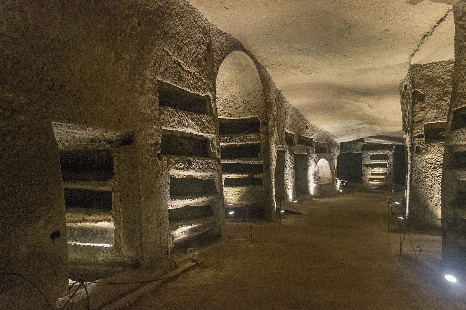 Lit burial galleries carved into tuff at the Catacombs of San Gennaro in Naples