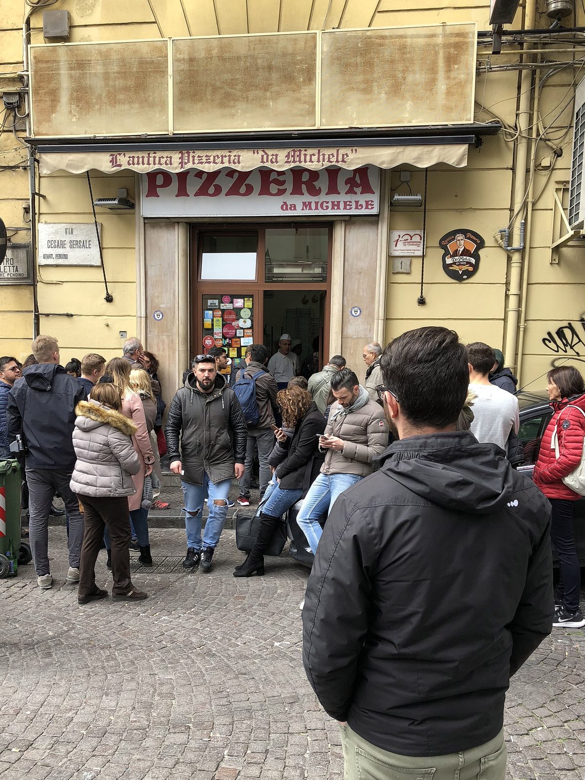 The queue outside L'Antica Pizzeria da Michele, where many go looking for the best pizza in Naples, Italy