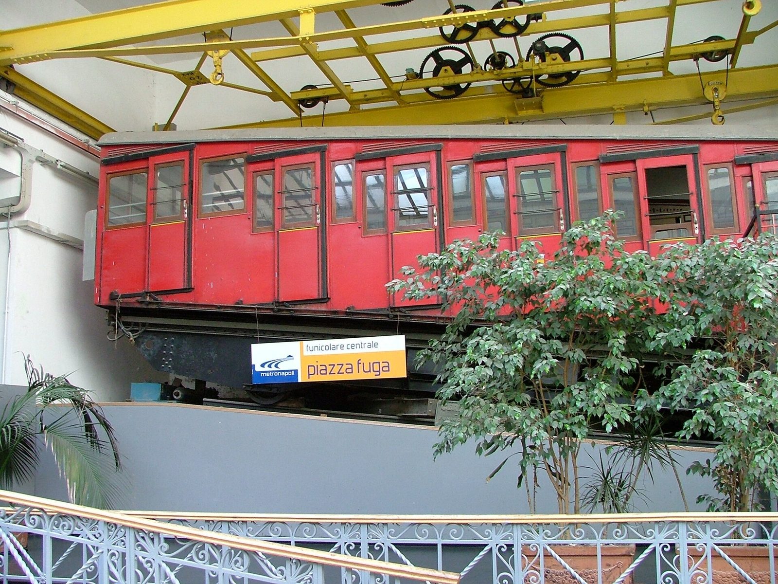 An older red car of the Funicolare Centrale at the Piazza Fuga station in Vomero