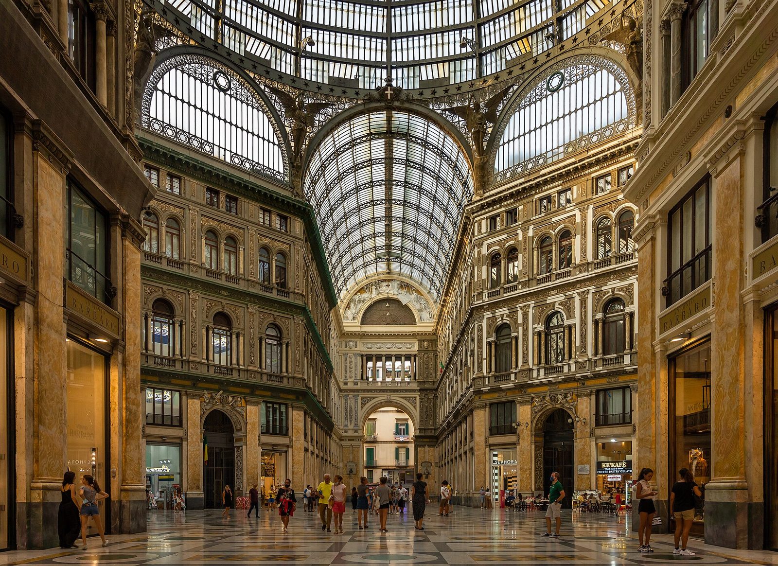 The glass dome and marble floor of the Galleria Umberto I shopping arcade in Naples