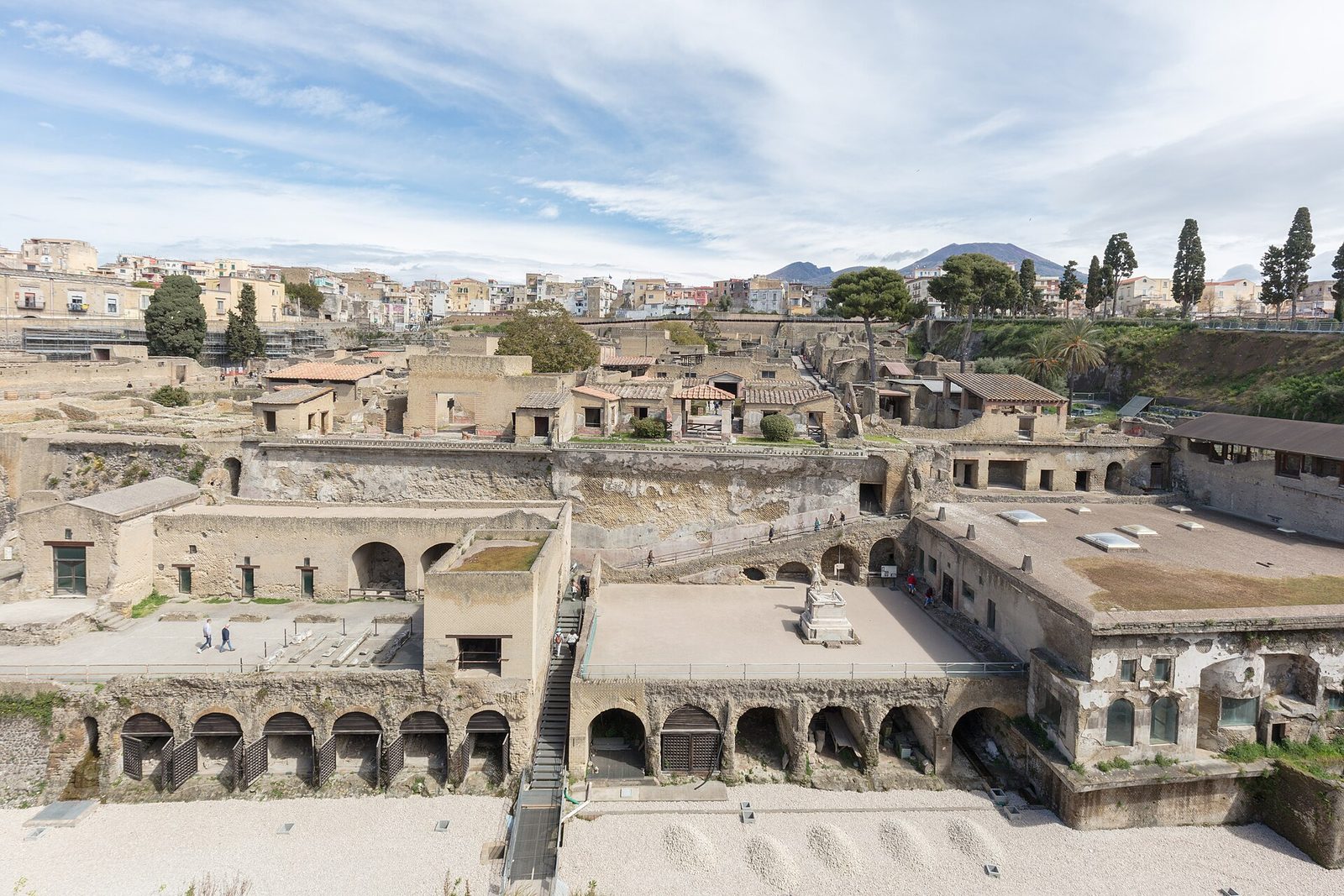The excavated Roman town of Herculaneum below modern Ercolano, with Mount Vesuvius on the horizon