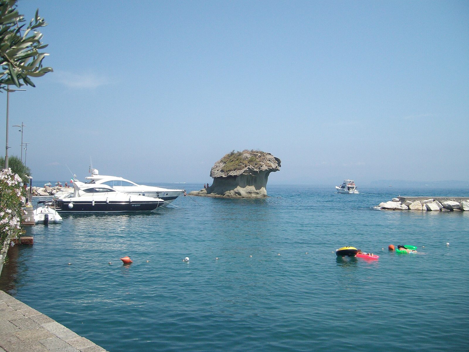 The mushroom-shaped rock known as Il Fungo in the bay of Lacco Ameno on Ischia, with boats around it