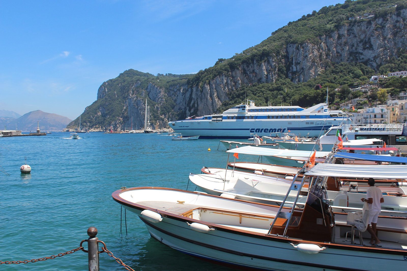 A Caremar ferry and small boats in the harbor at Marina Grande on Capri