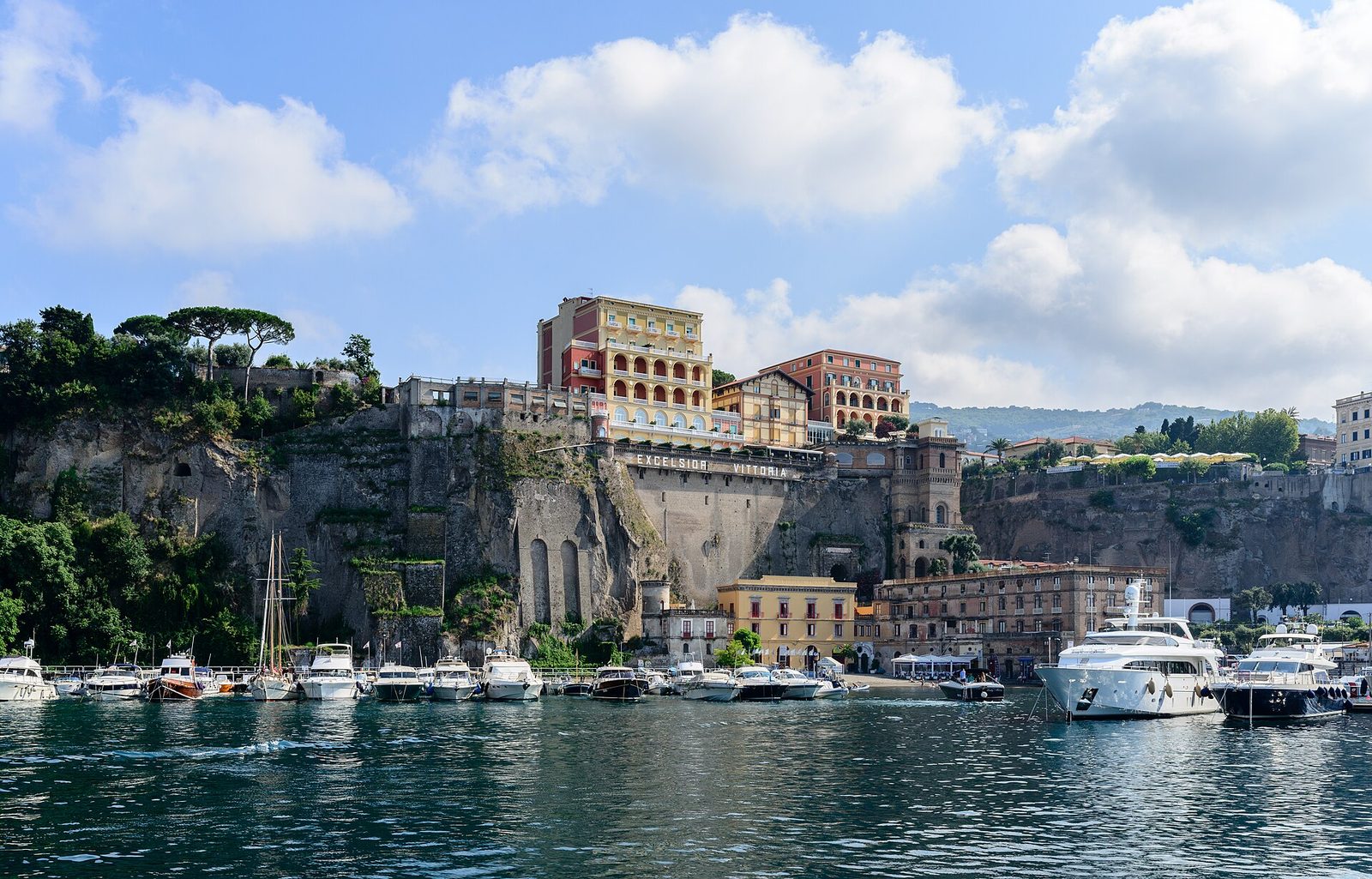 Sorrento's ferry port at Marina Piccola below the cliffs, with boats at the quay