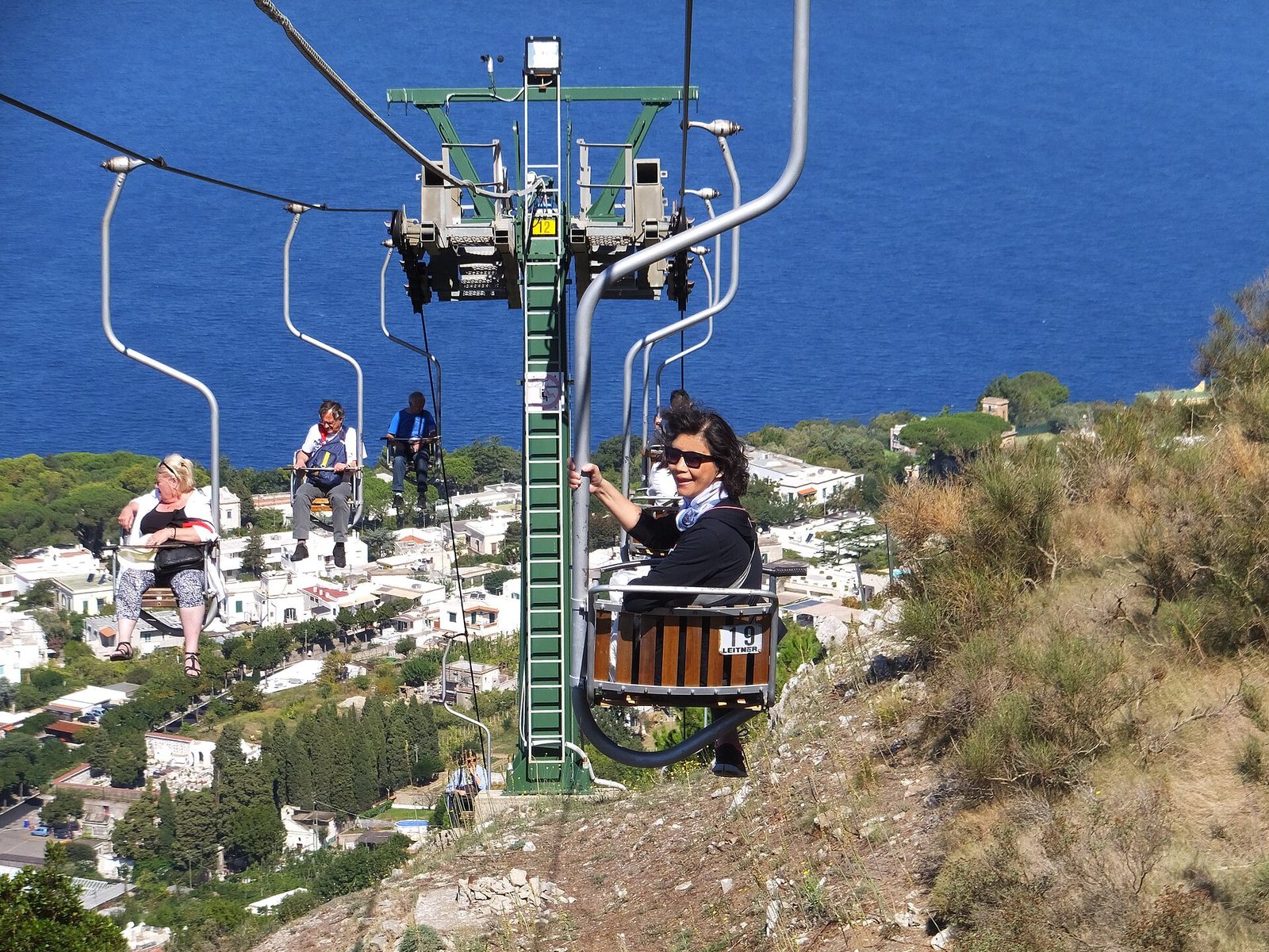 Passengers on the Monte Solaro chairlift above Anacapri, one of the rides still running for Capri in winter