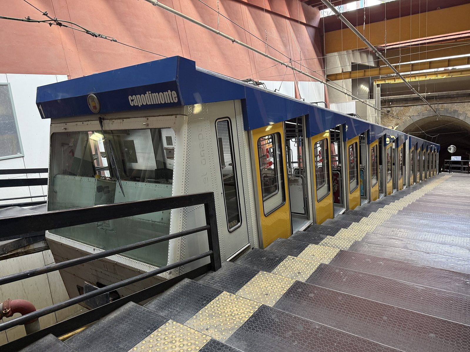 A car of the Montesanto funicular waiting at the station platform in Naples