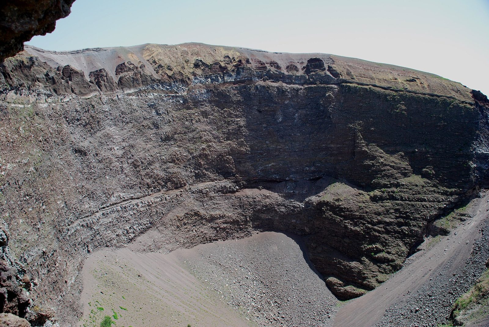 The crater of Mount Vesuvius seen from the rim path, with its steep rocky walls