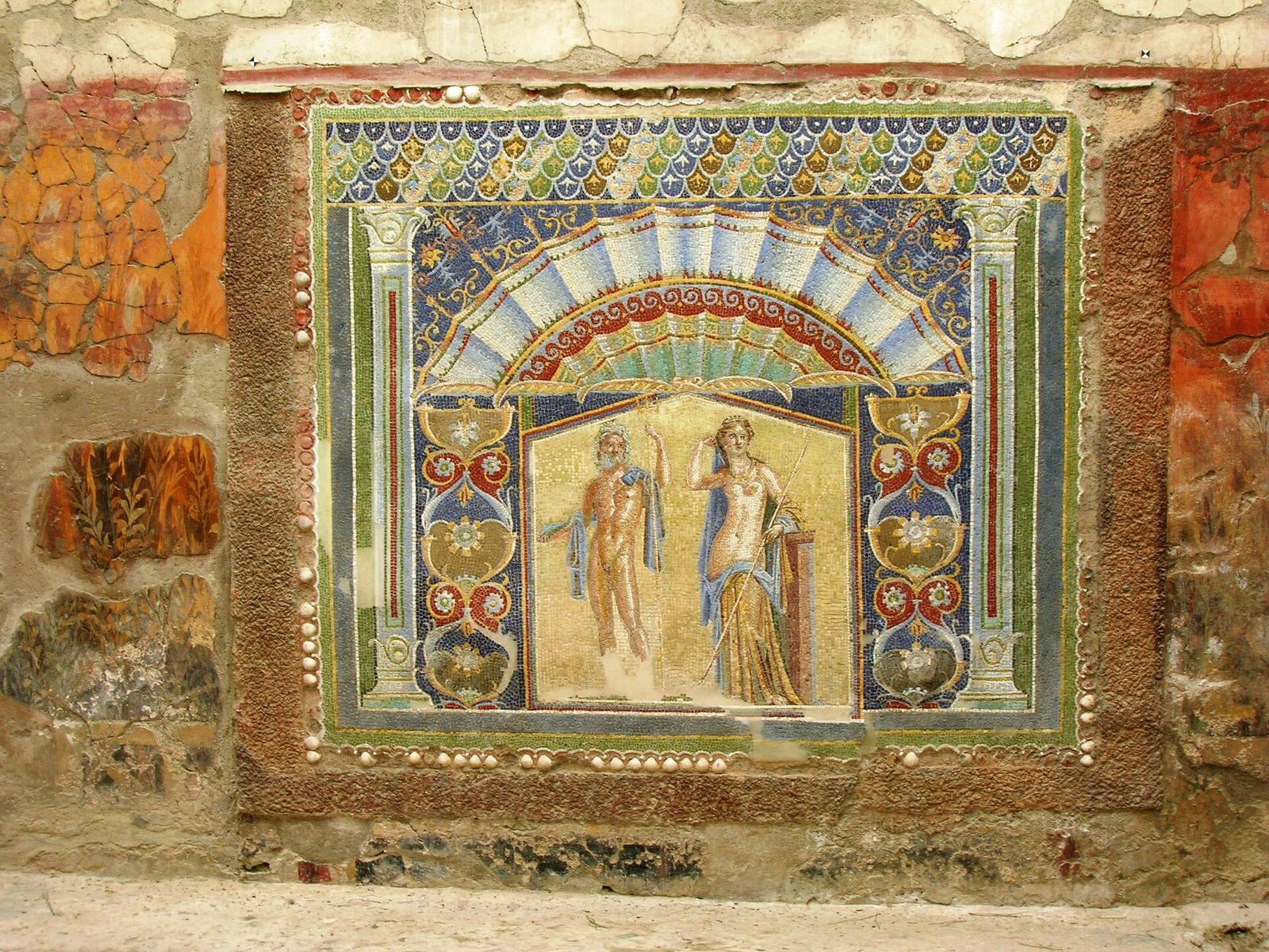 The blue and gold wall mosaic of Neptune and Amphitrite in their house at Herculaneum