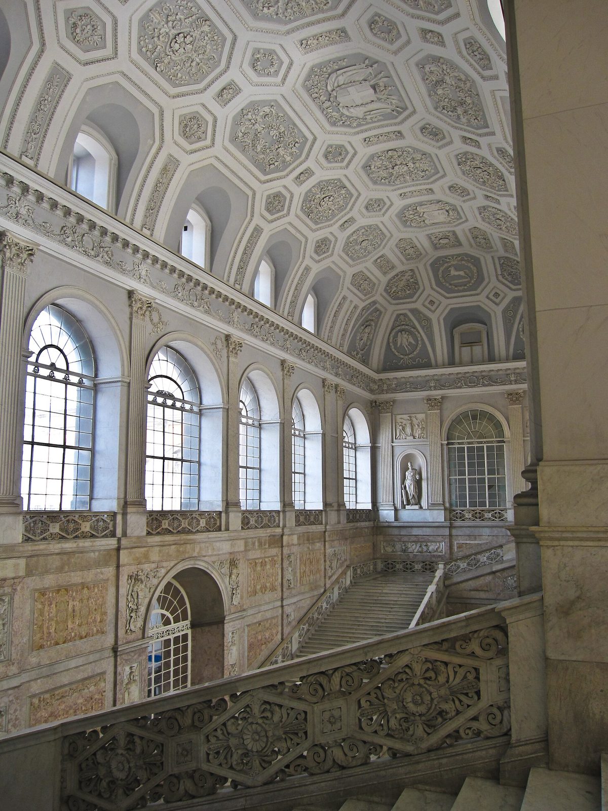The grand staircase and coffered vault of the Palazzo Reale, the royal palace in Naples