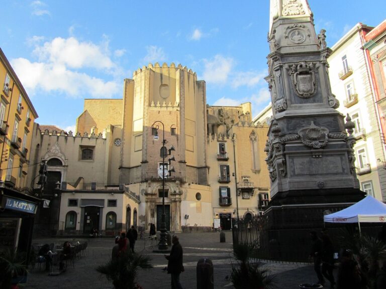Piazza San Domenico Maggiore in the centro storico of Naples, with its Baroque spire and the church rising behind