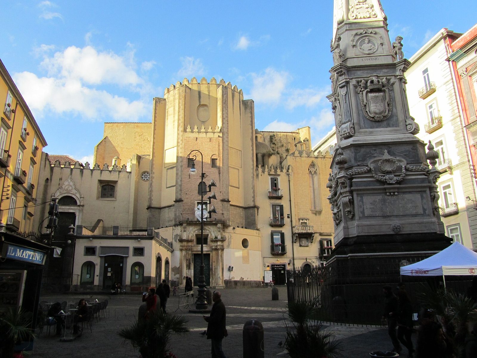Piazza San Domenico Maggiore in the centro storico of Naples, with its Baroque spire and the church rising behind