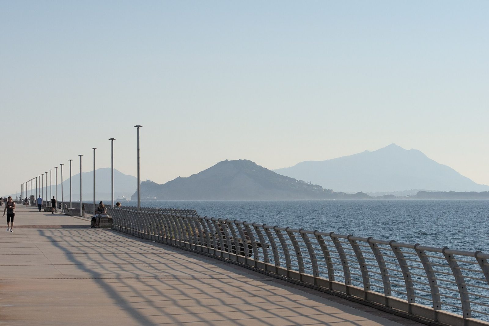 The Pontile Nord pier at Bagnoli in Naples, a promenade over the sea with Nisida and Ischia beyond