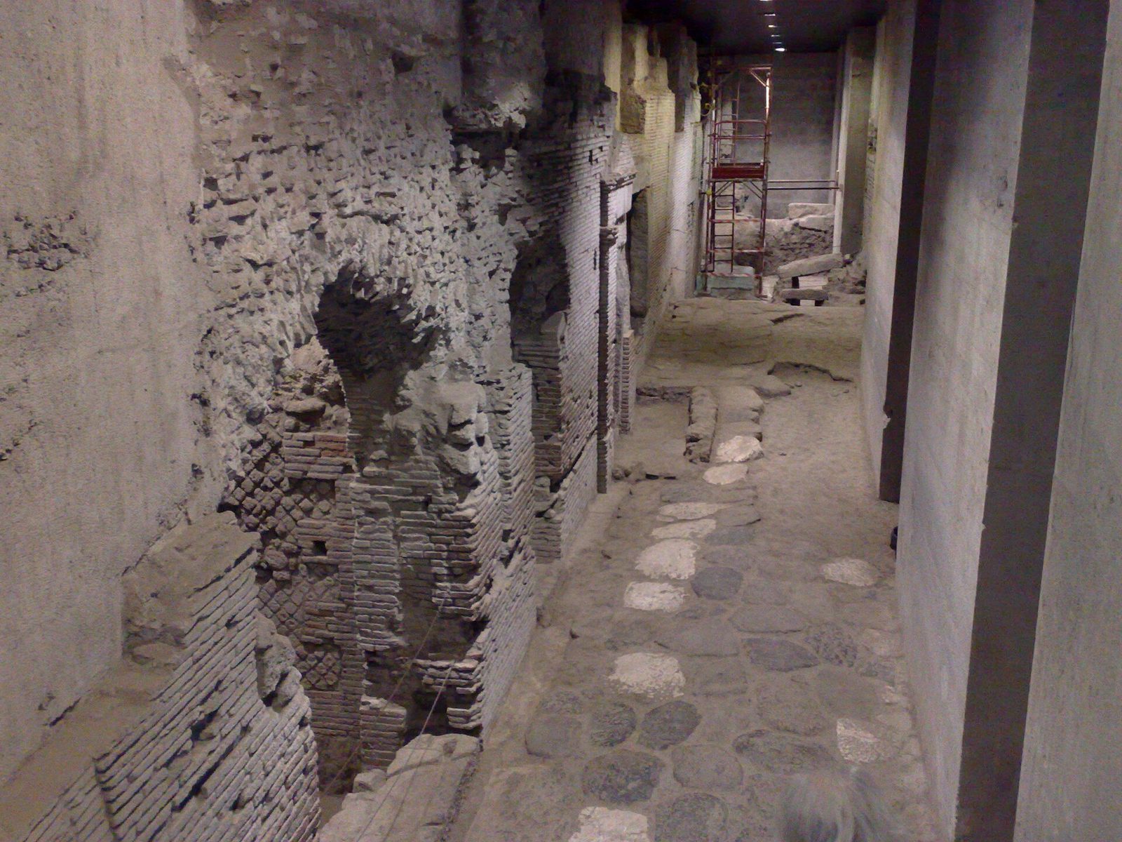 An excavated Roman street with the remains of shops beneath the church of San Lorenzo Maggiore in Naples