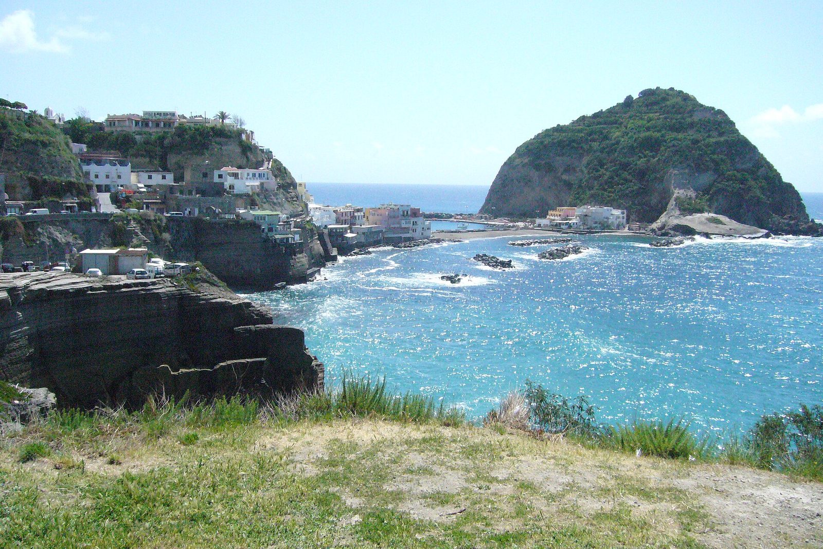 The bay and fishing village of Sant'Angelo on Ischia, Italy, with its rocky islet joined to the shore