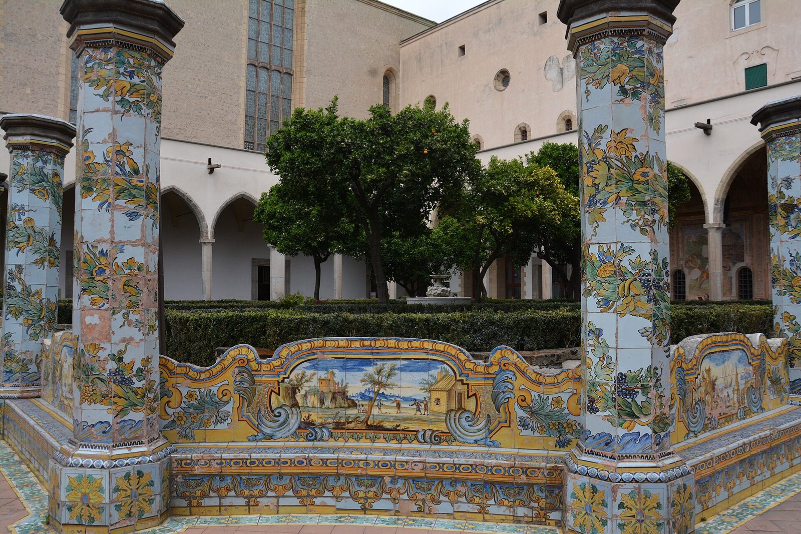 Hand-painted majolica tile columns and benches in the cloister of Santa Chiara in Naples, Italy