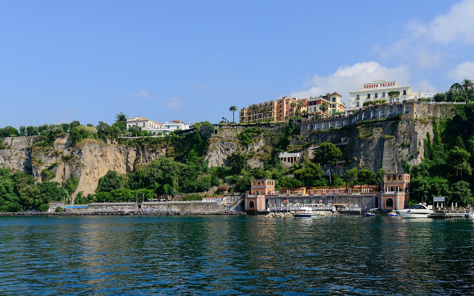 The cliffs of Sorrento with bathing platforms and piers built out over the sea below the hotels