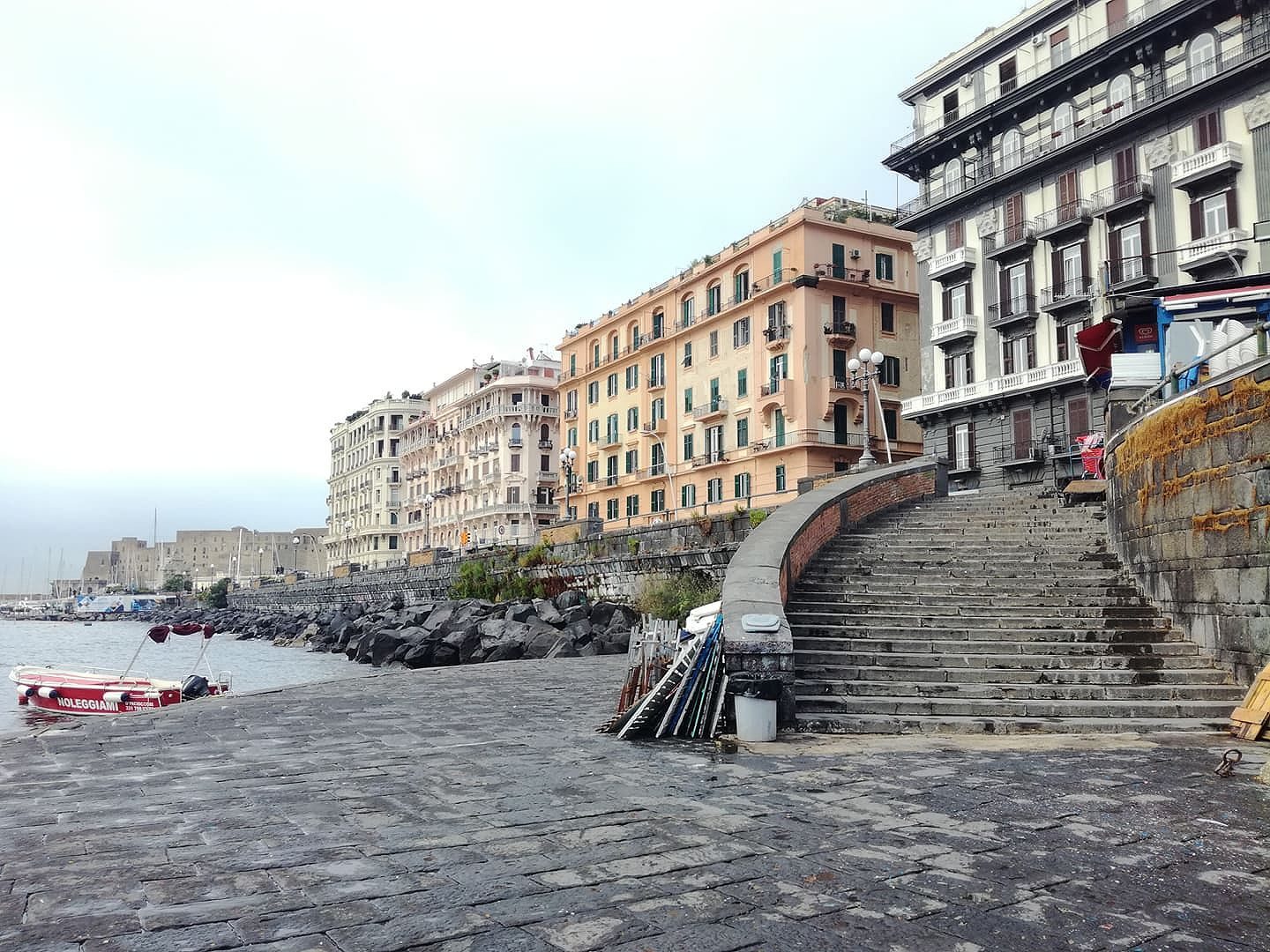 Steps down to the sea on Via Caracciolo, the Naples seafront promenade