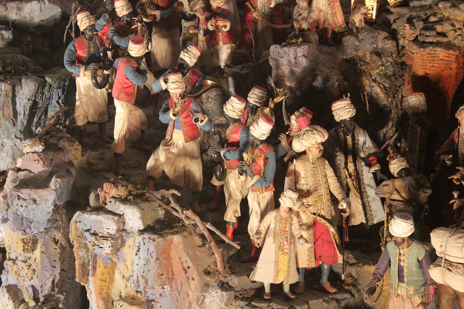 Crowds of richly dressed figures in the Cuciniello nativity scene at the Certosa di San Martino in Naples