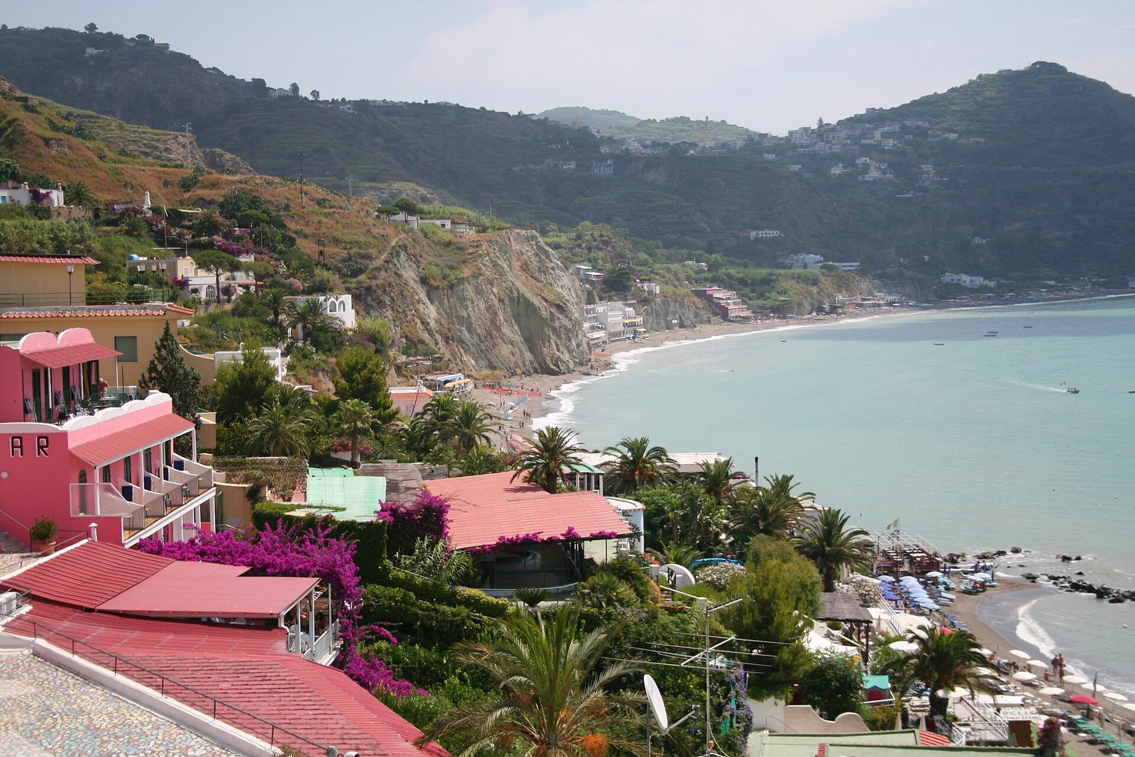 The long curve of the Maronti beach on Ischia seen from Sant'Angelo, one of the best beaches near Naples, Italy