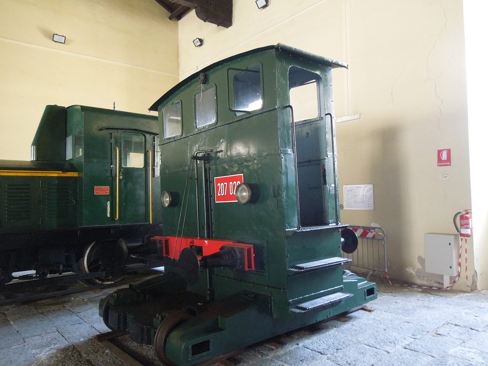 A green shunting locomotive on display at the Pietrarsa national railway museum near Naples